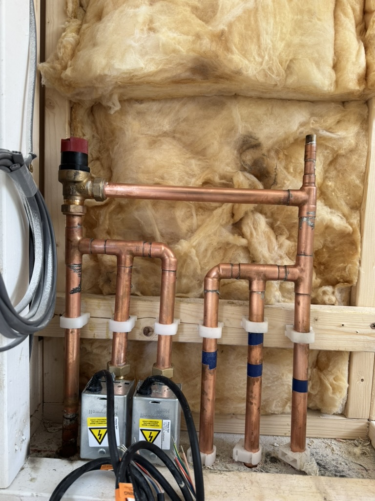 Neatly routed copper pipework for a heating system installation