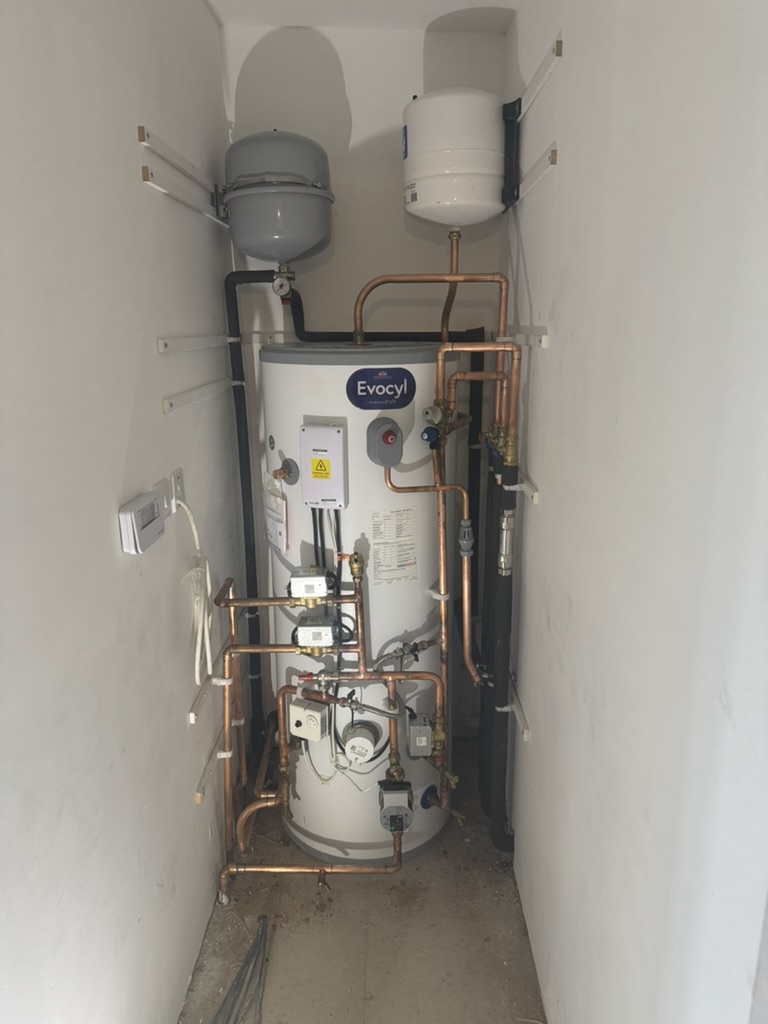 Hot-water cylinder and expansion vessels with completed pipework